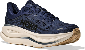 Quarter turn view Men's HOKA Footwear style name Bondi 9 Wide in color Midnight Blue/ Varsity Navy. Sku: 1162013-MVR
