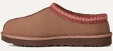 Brown slipper with red and beige trim on a white background