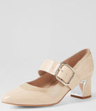 Beige shoe with a gold buckle on a light gray background