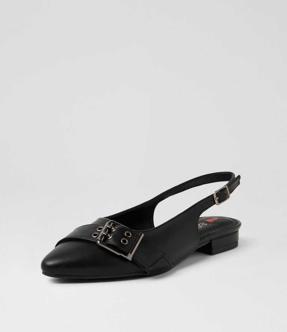 A single black leather slingback flat shoe with a pointed toe and a decorative buckle strap across the vamp, photographed on a light gray studio background.