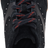 A close-up top-down view of a black suede sneaker with red laces and a white heel tab, showing the 'getfex' brand logo on the inner sole.