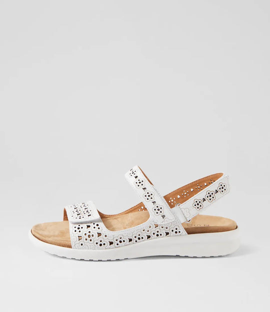 White sandal with wooden sole on a light gray background
